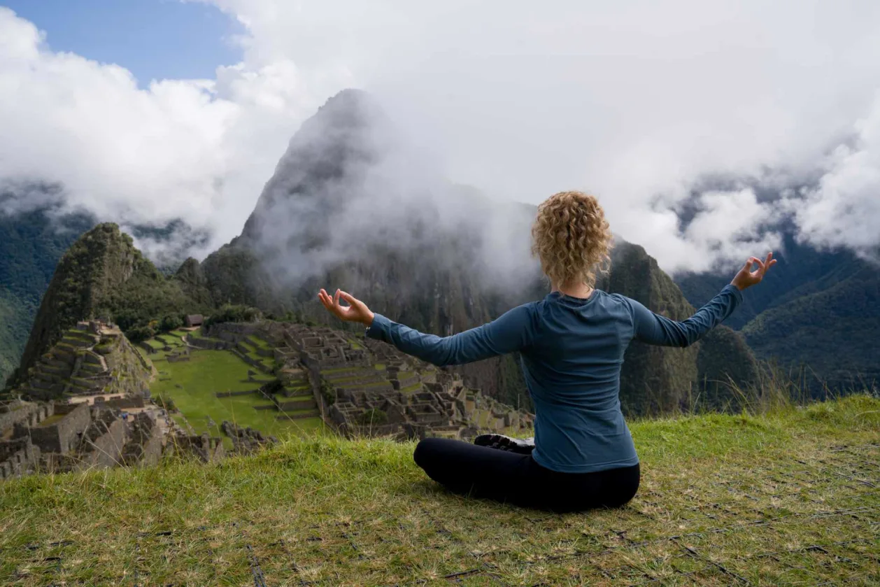 woman meditating machu picchu